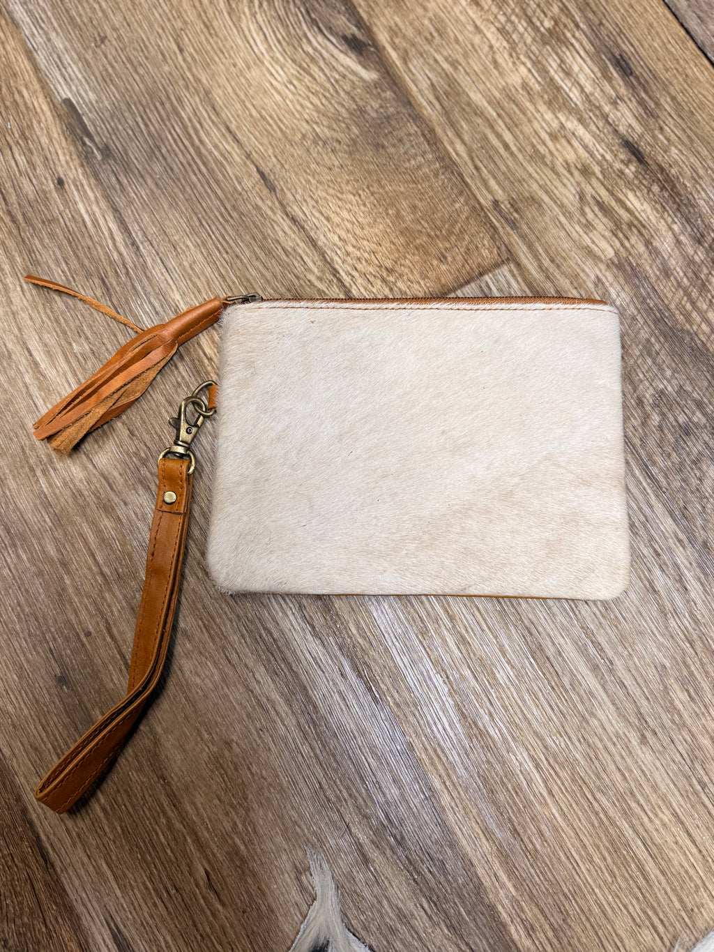 Genuine cowhide clutch with tassel