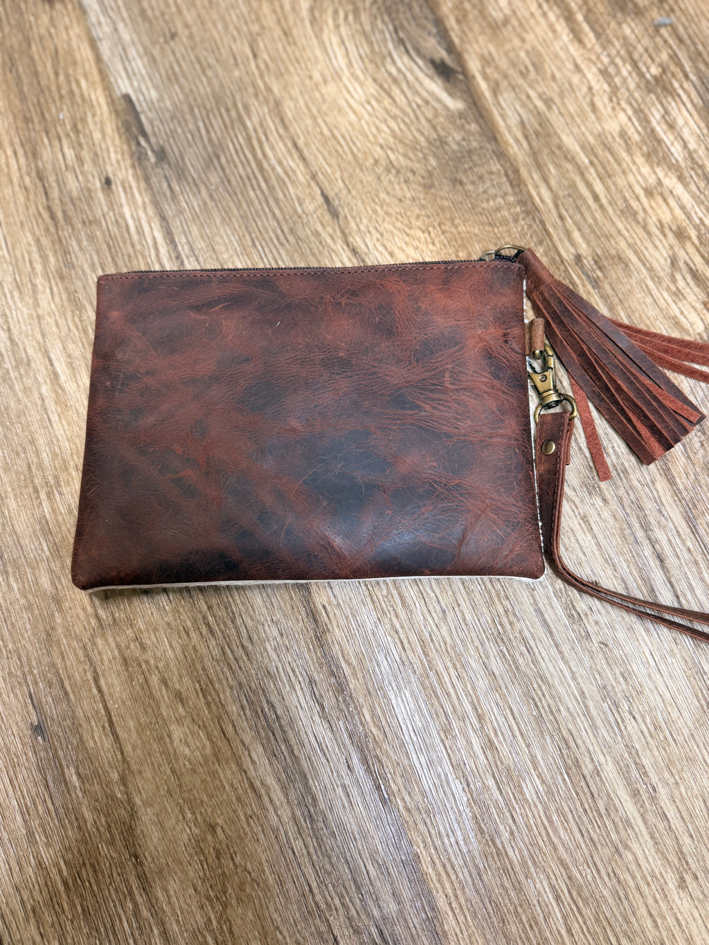 Genuine cowhide clutch with tassel