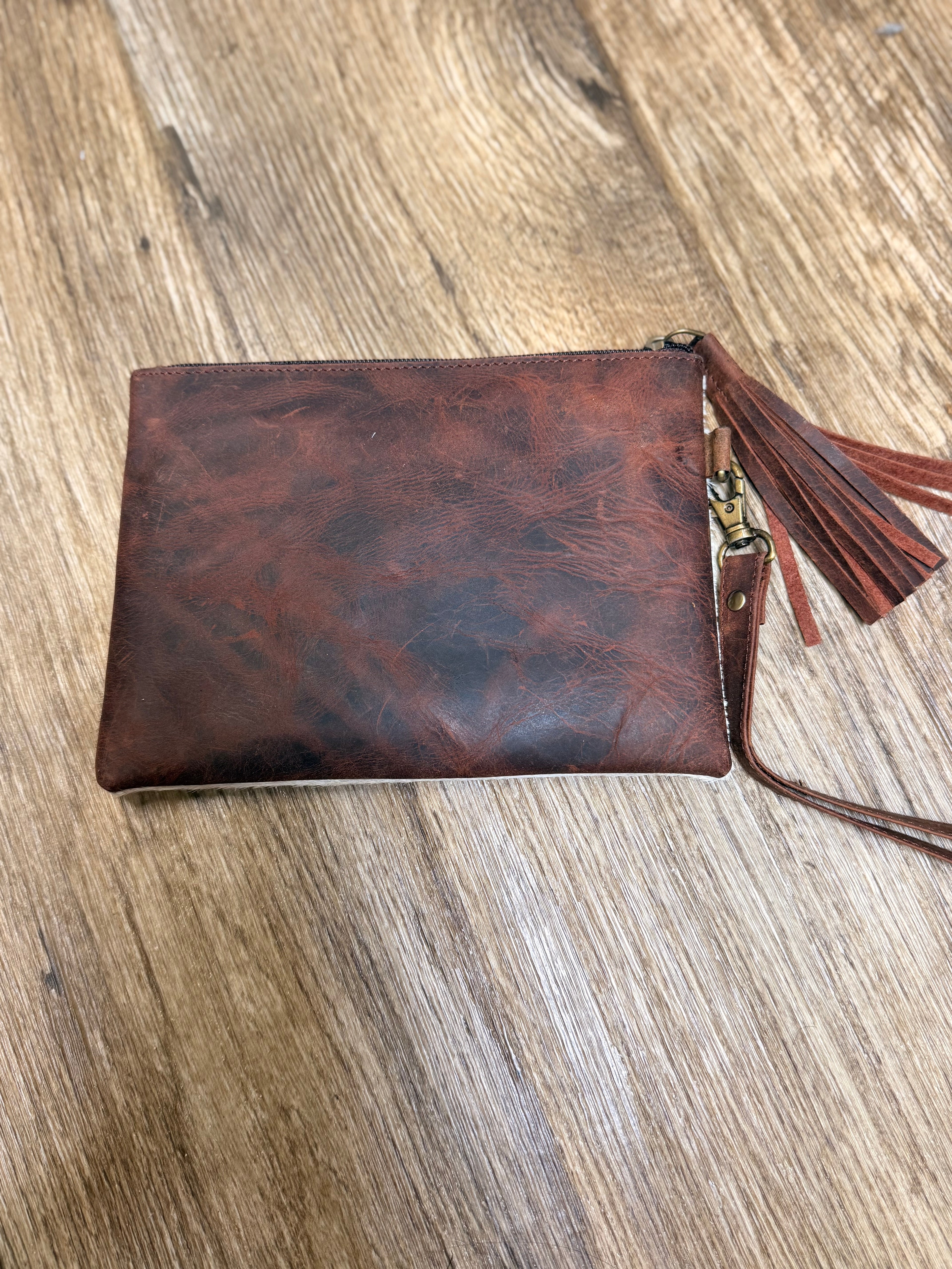 Genuine cowhide clutch with tassel