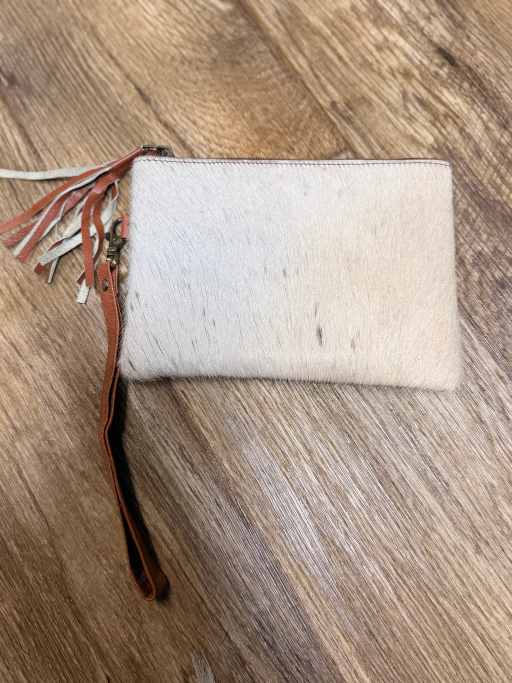 Genuine cowhide clutch with tassel