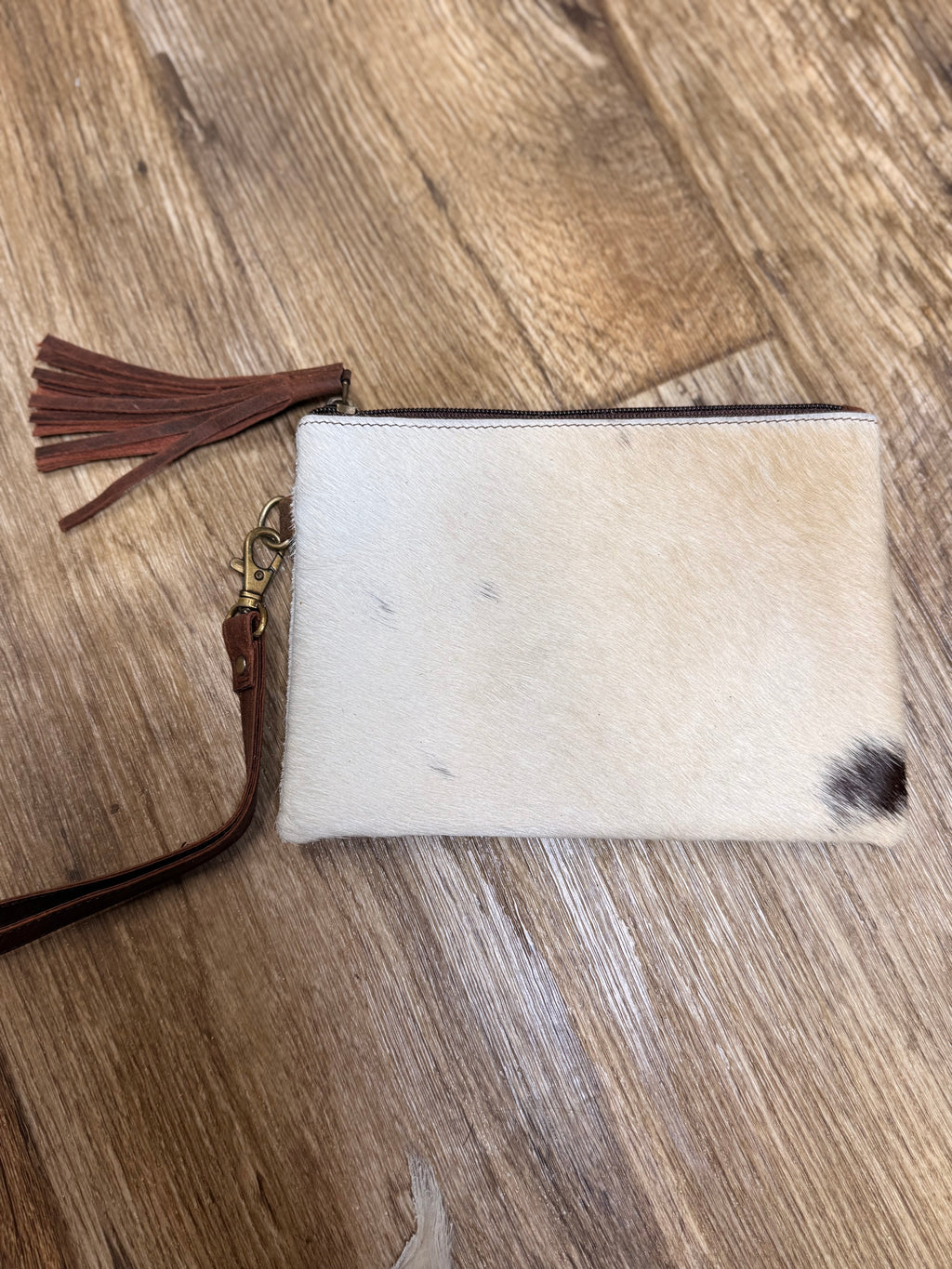 Genuine cowhide clutch with tassel