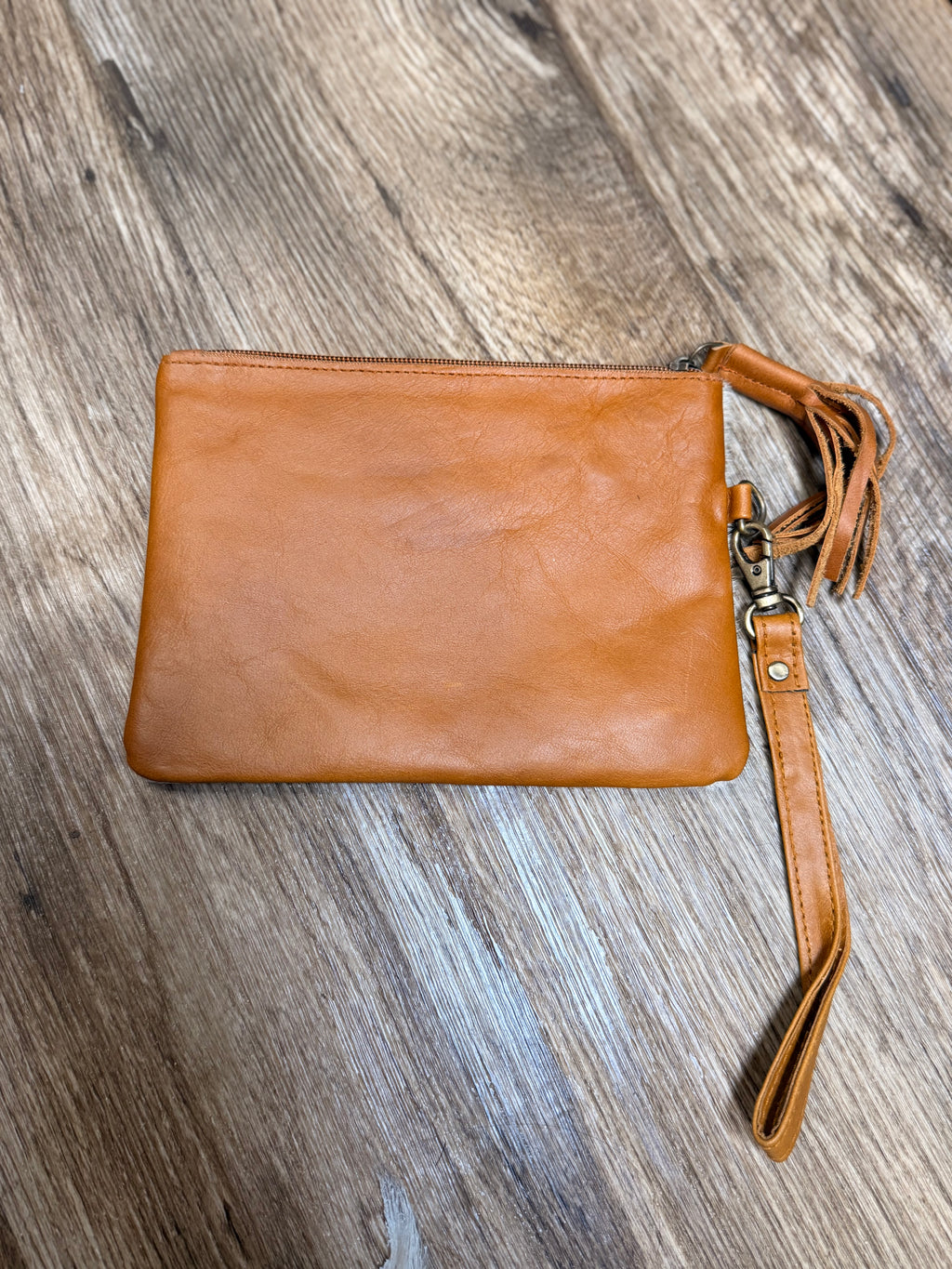 Genuine cowhide clutch with tassel