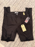 Vibrant black distressed skinny jean